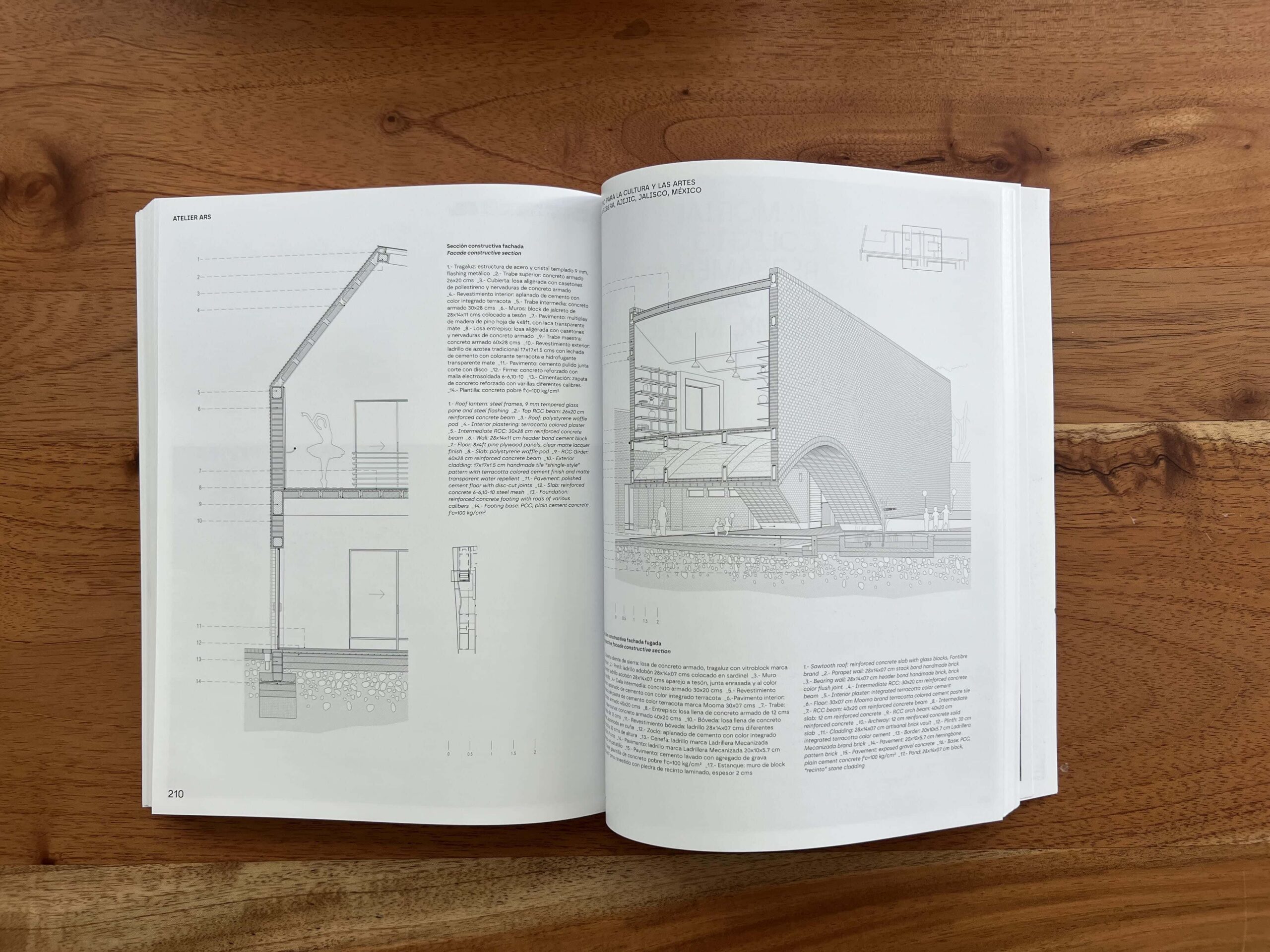 An open book featuring black and white text and sketches