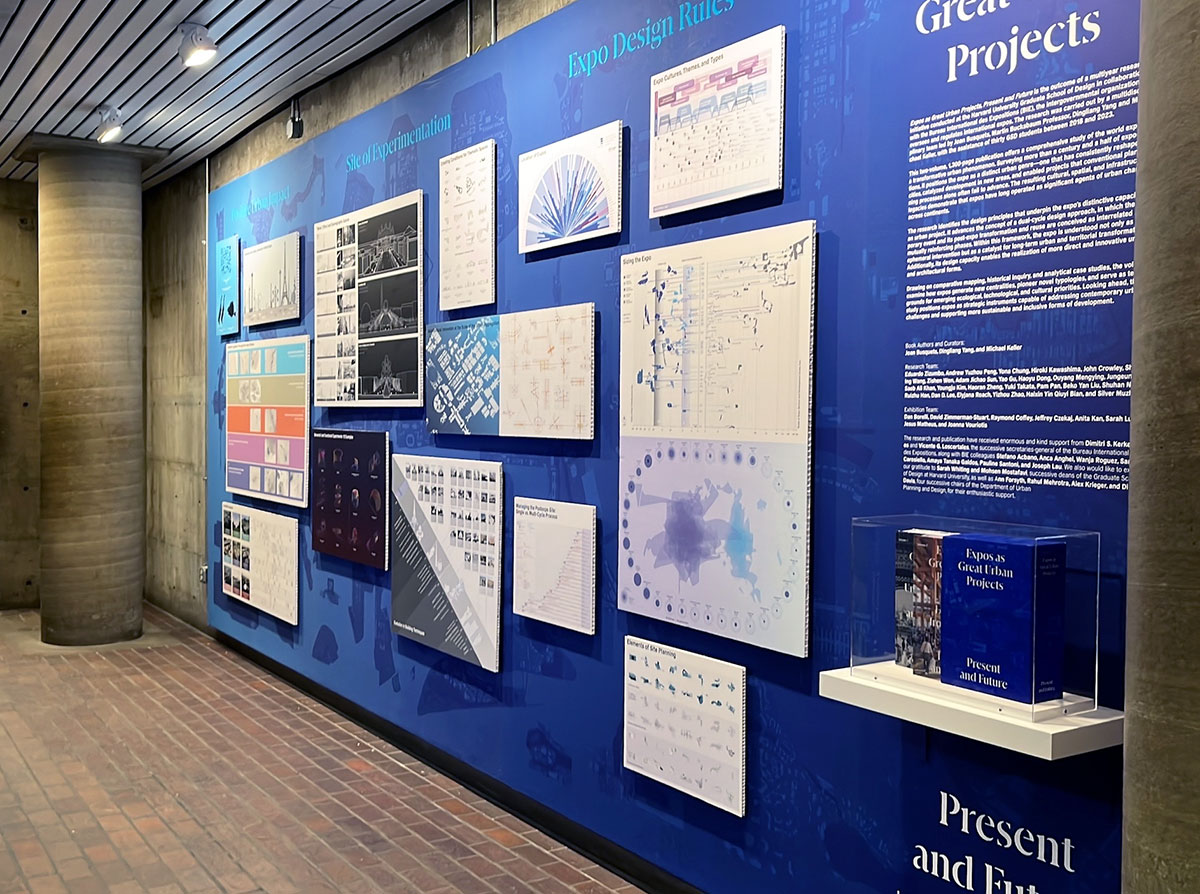 A blue wall displaying a variety of images and a shelf with a set of books.