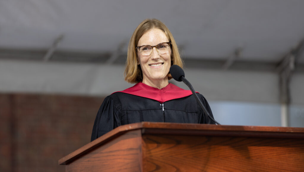 Woman in graduation garb.