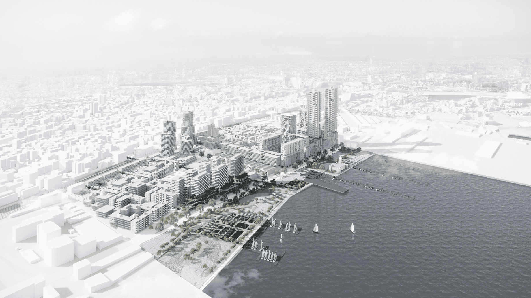 An aerial view of a waterfront urban development featuring tall buildings, parks, and green spaces. A marina with several boats is visible along the shore. The cityscape extends into the distance, surrounded by fog.