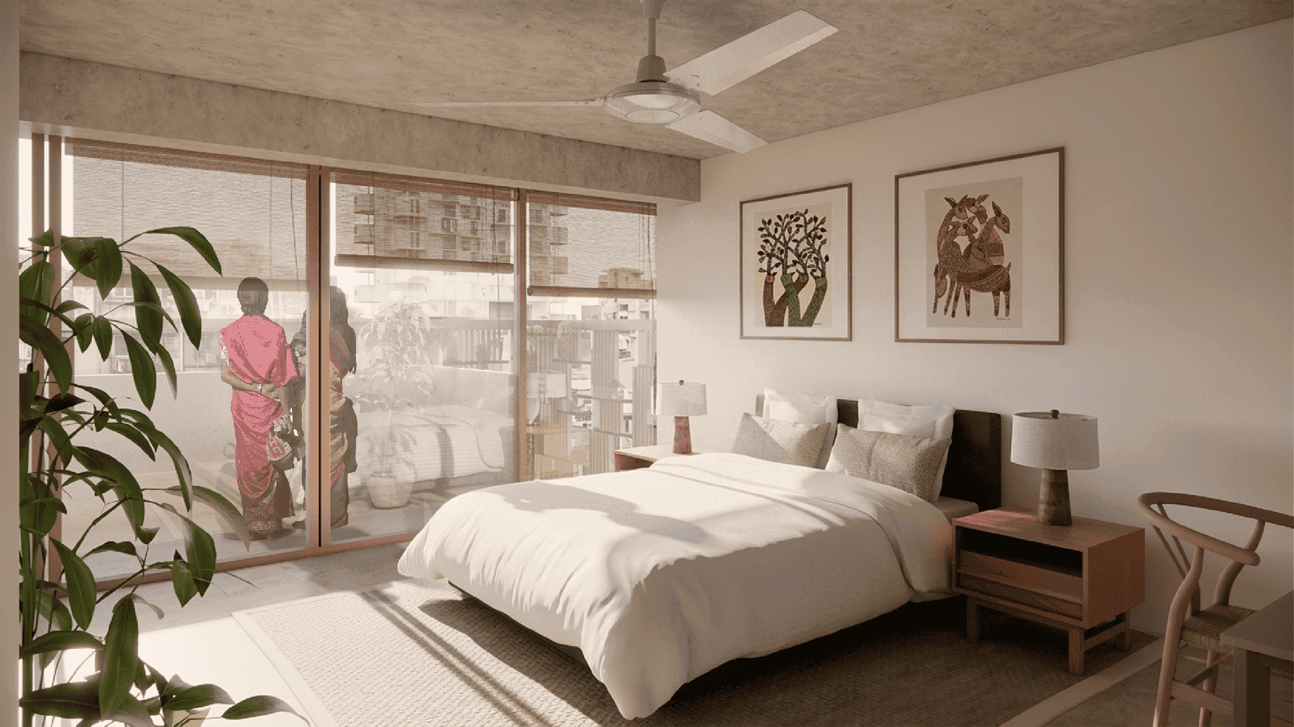 A modern bedroom featuring a large bed with white bedding and two wooden nightstands. Lamps are placed on each nightstand. Two colorful paintings, one of a tree and another of an abstract scene, hang on the wall above the bed. A ceiling fan is positioned centrally. A row of sliding glass doors with curtains faces a balcony, where two individuals are standing. A potted plant occupies the corner of the room.