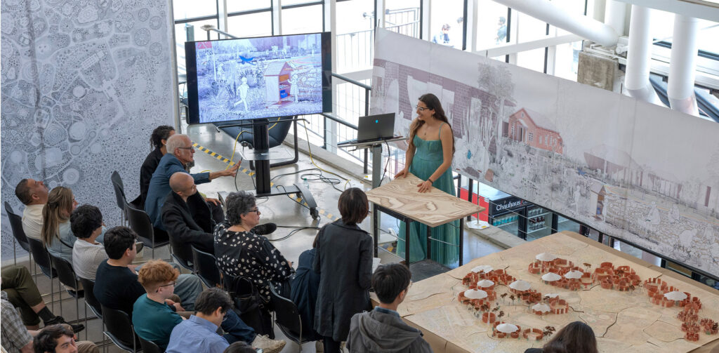Leslie Ponce-Diaz stands with her model at a thesis review