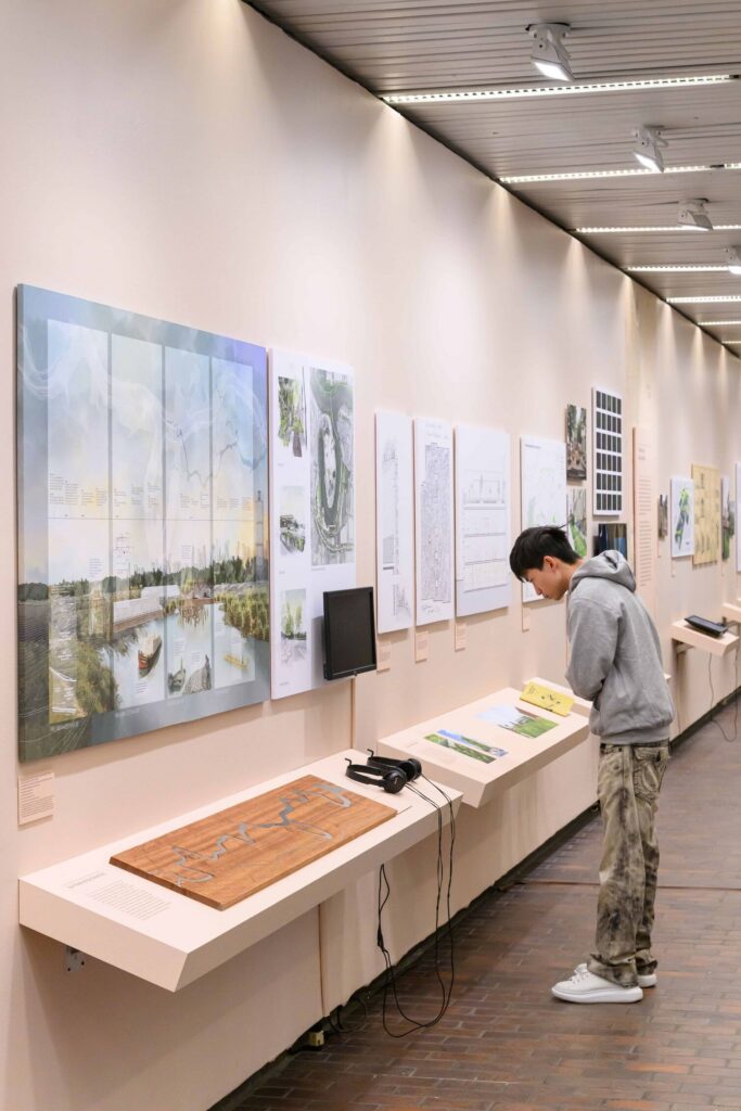 A student observes an exhibition in the Druker Design Gallery