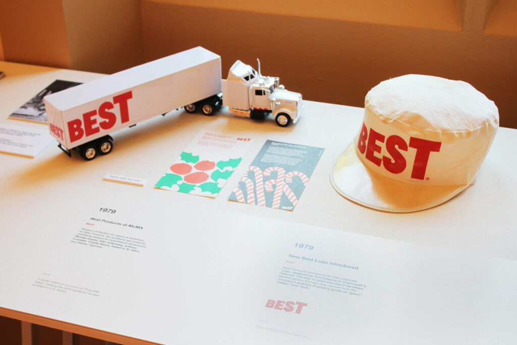 Timeline on a table with a hat and a toy truck.