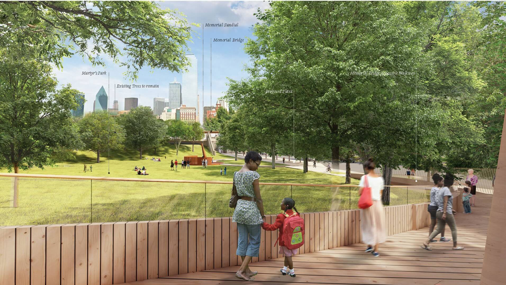 people walk down a path by green space
