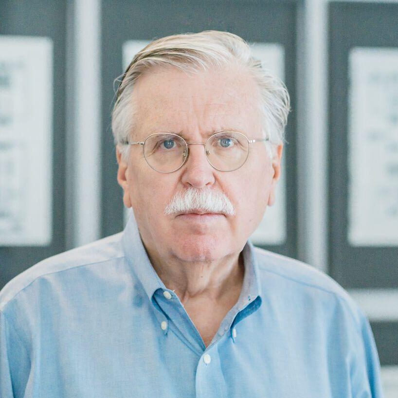 Ralph Johnson headshot in blue button up