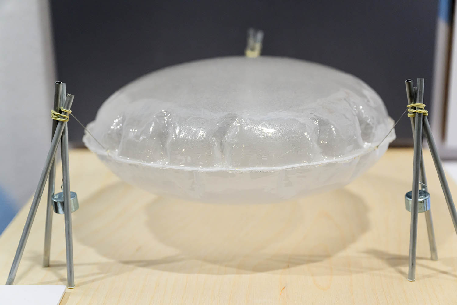 A model of an inflatable structure made of wood, metal, and vacu-formed plastic.