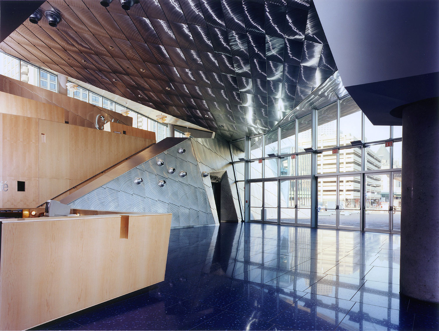 Inside view of lobby with wood and stainless steel.