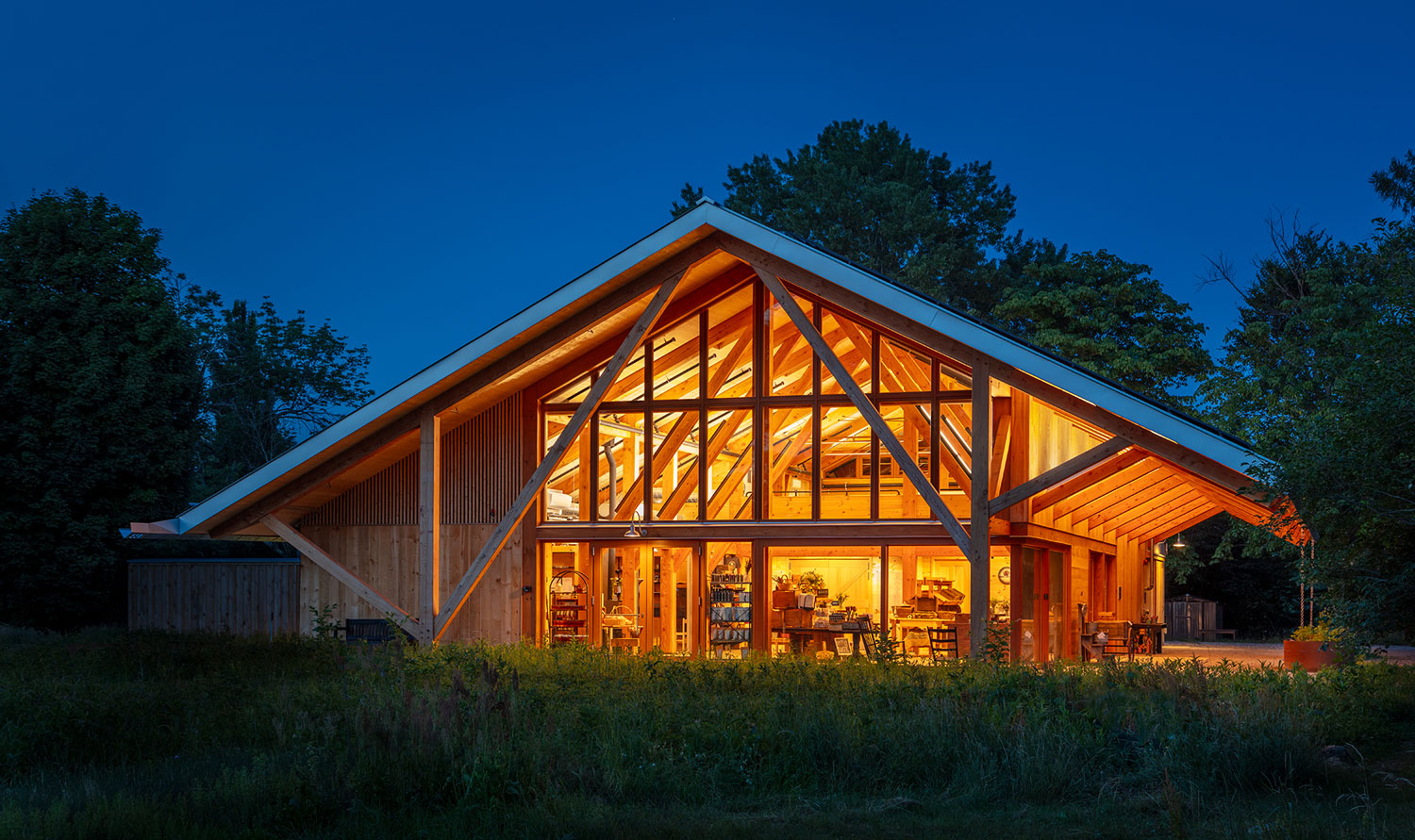 Glowing wooden building at night.