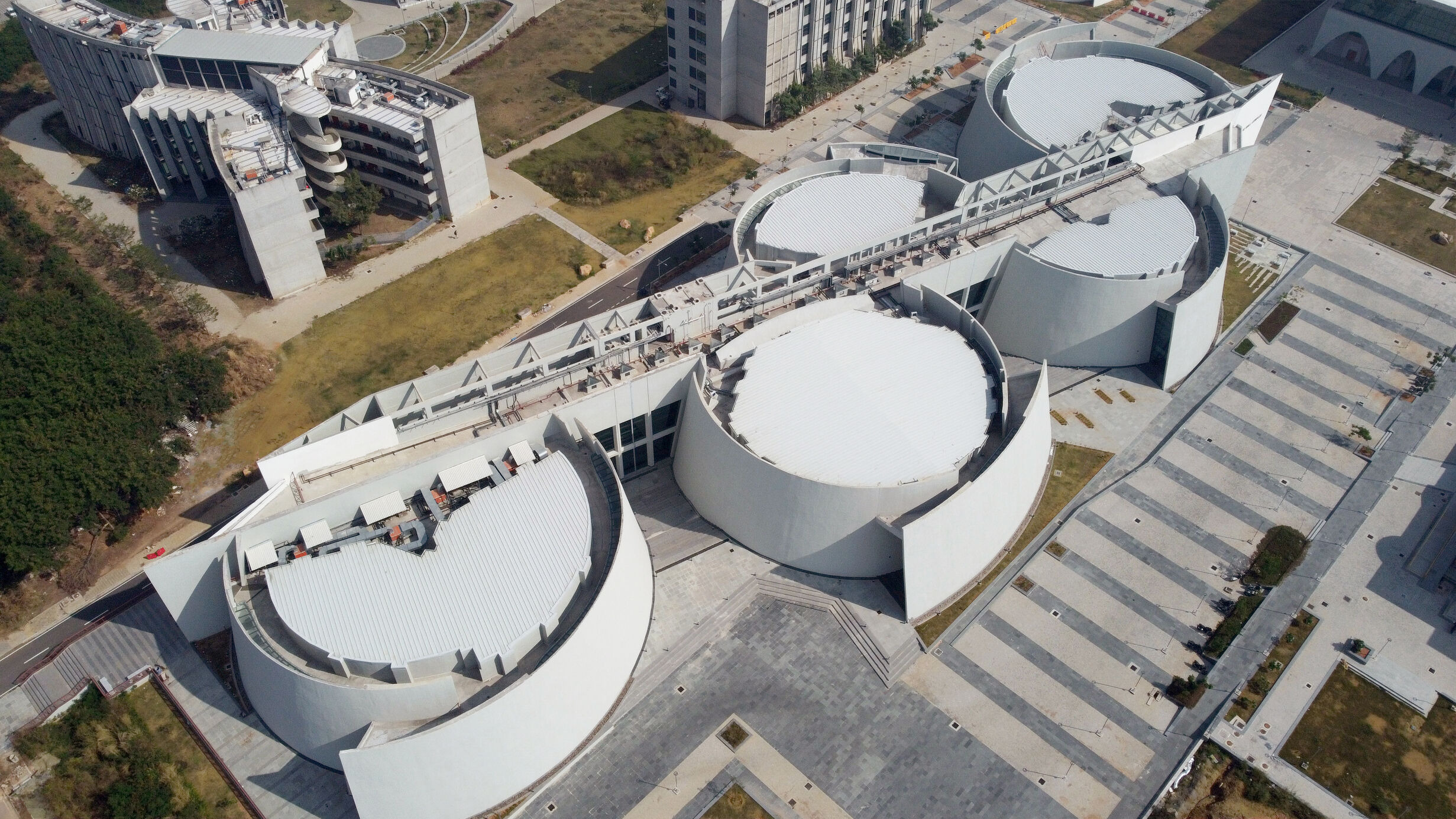 Aerial view of the Lecture Hall Complex at IIT Hyderabad, comprised of five white half-moon buildings