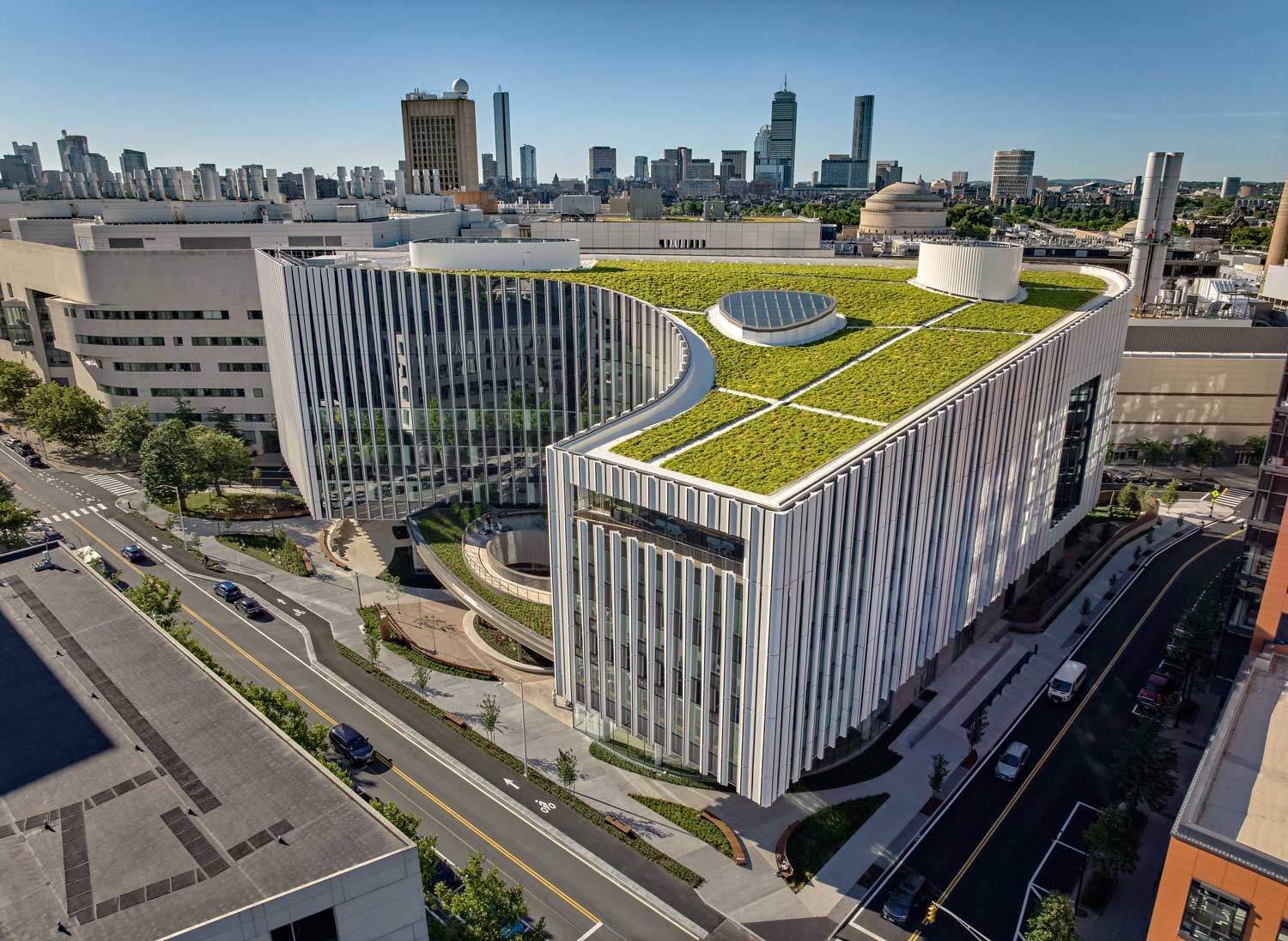Aerial view of building with green roof.