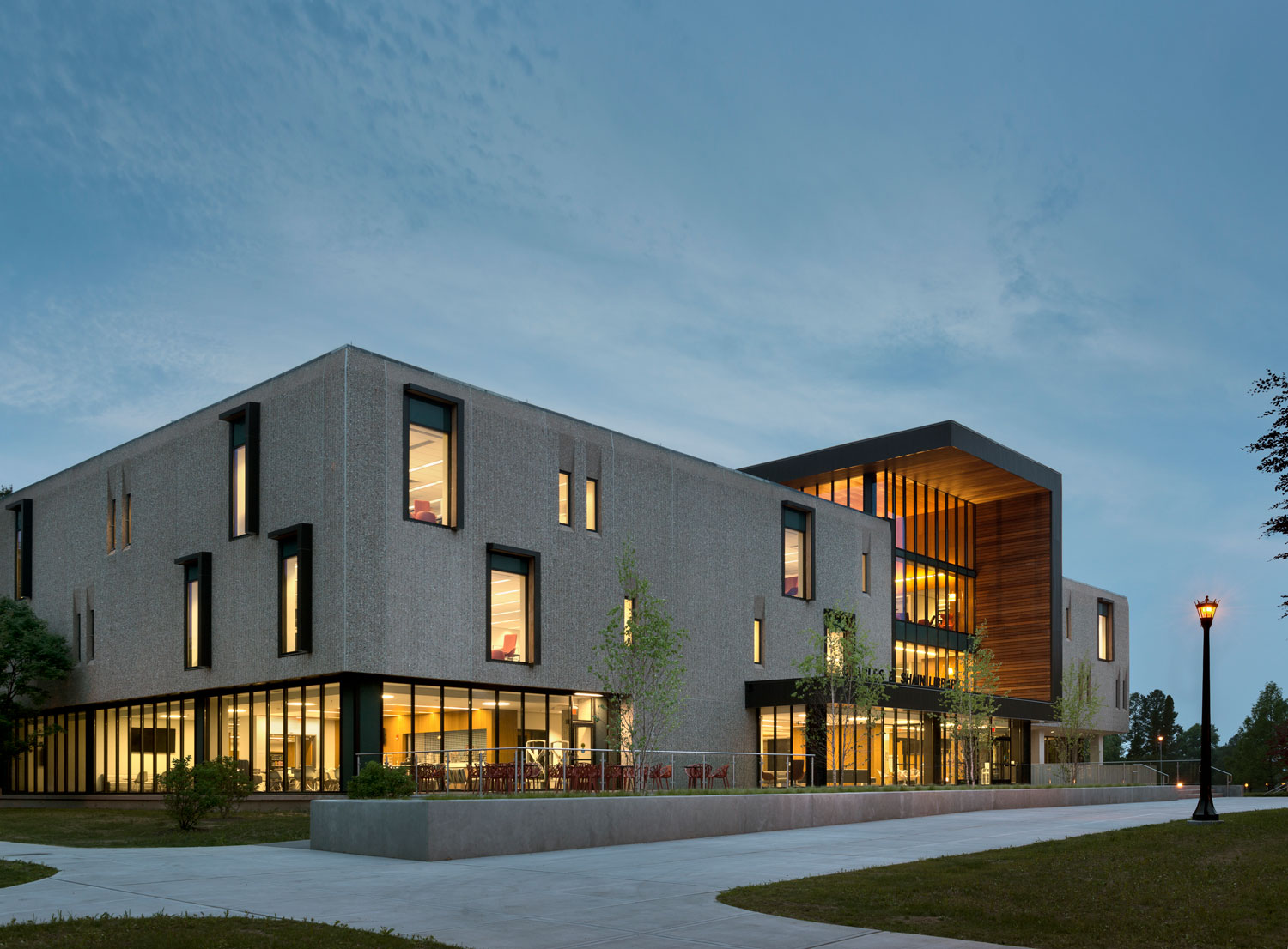 Concrete and wood building against a night sky.