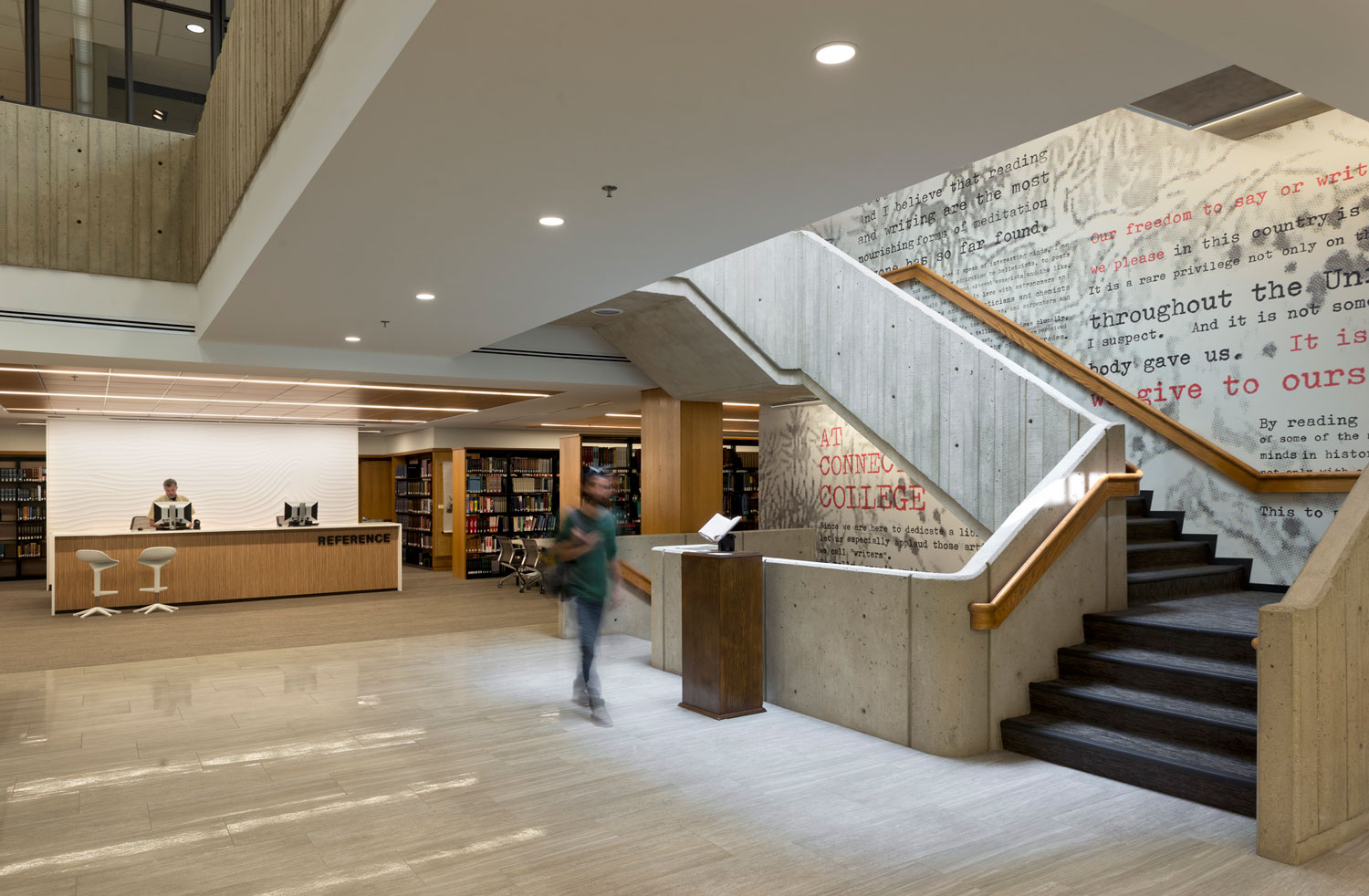 View inside a building, with stairway descending.