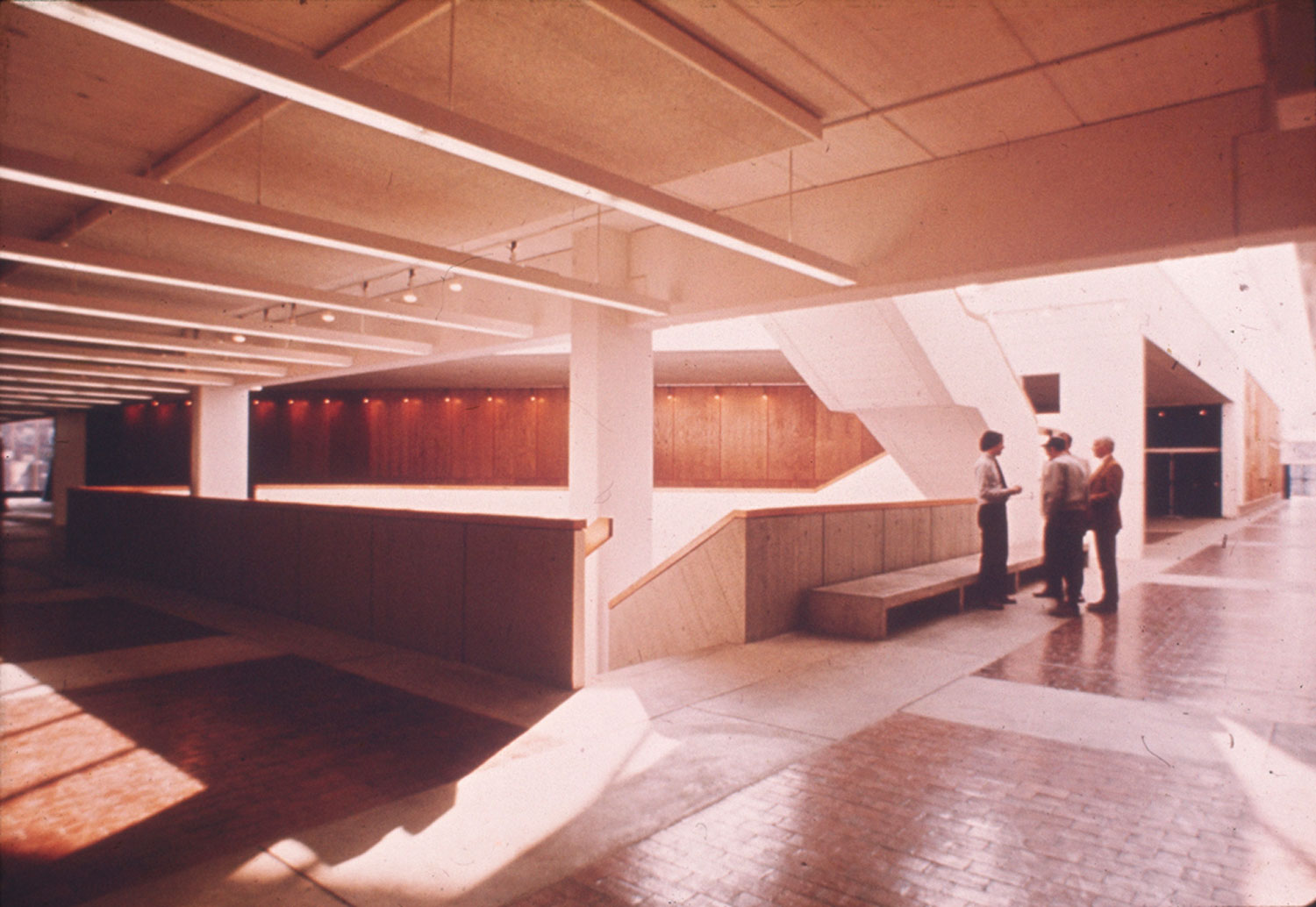 View of light-filled lobby and central staircase.