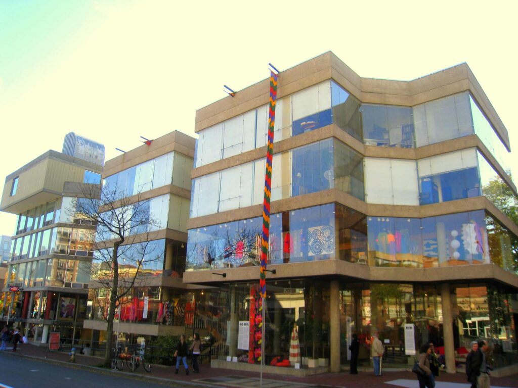 a glass-walled modernist concrete building